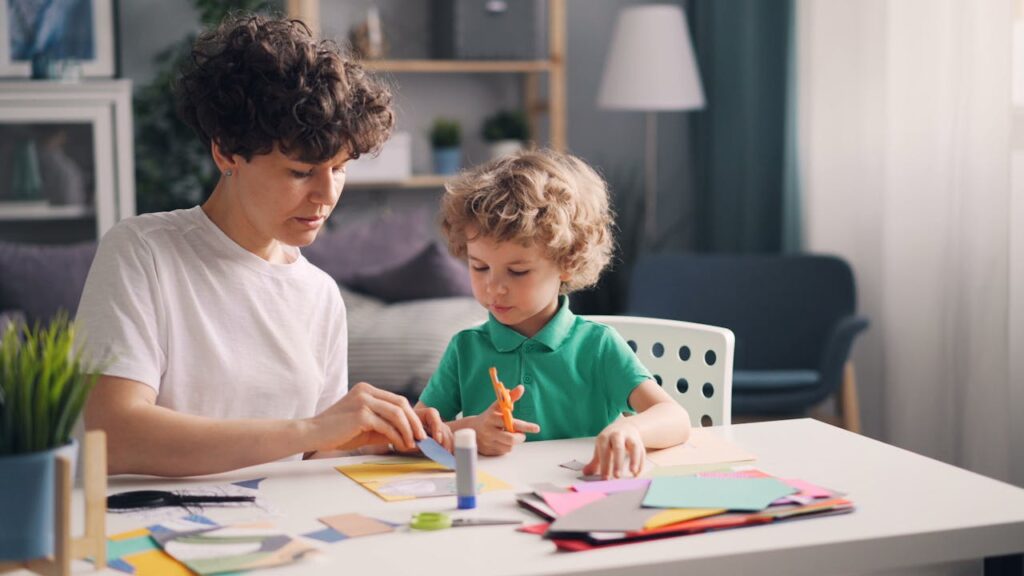pexels-photo-23224897 Mother and young child crafting together indoors, fostering creativity and bonding.